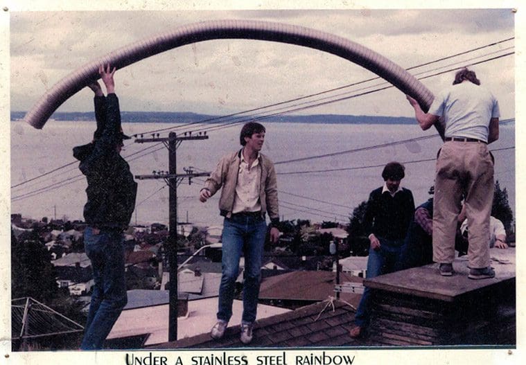 Photo of the Sutter Home and Hearth team on a roof installing a fireplace.