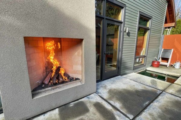 Outdoor wood log fireplace.