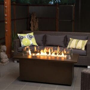 This beautiful bronze fire table with glass crystals by Regency create the perfect gathering space. Available in Stainless Steel or Sunset Bronze.