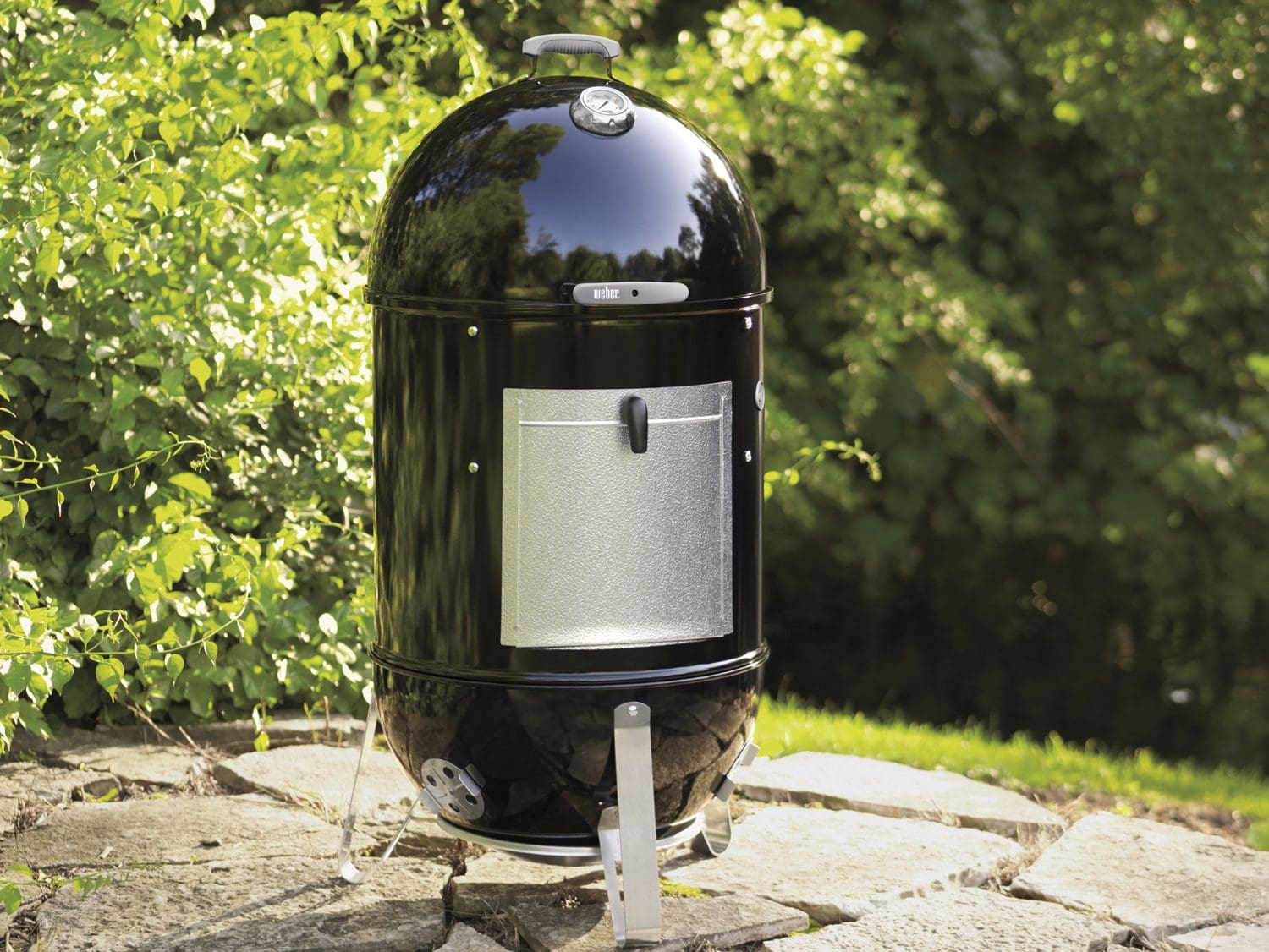The Weber Smokey Mountain charcoal smoker in the 14" size
