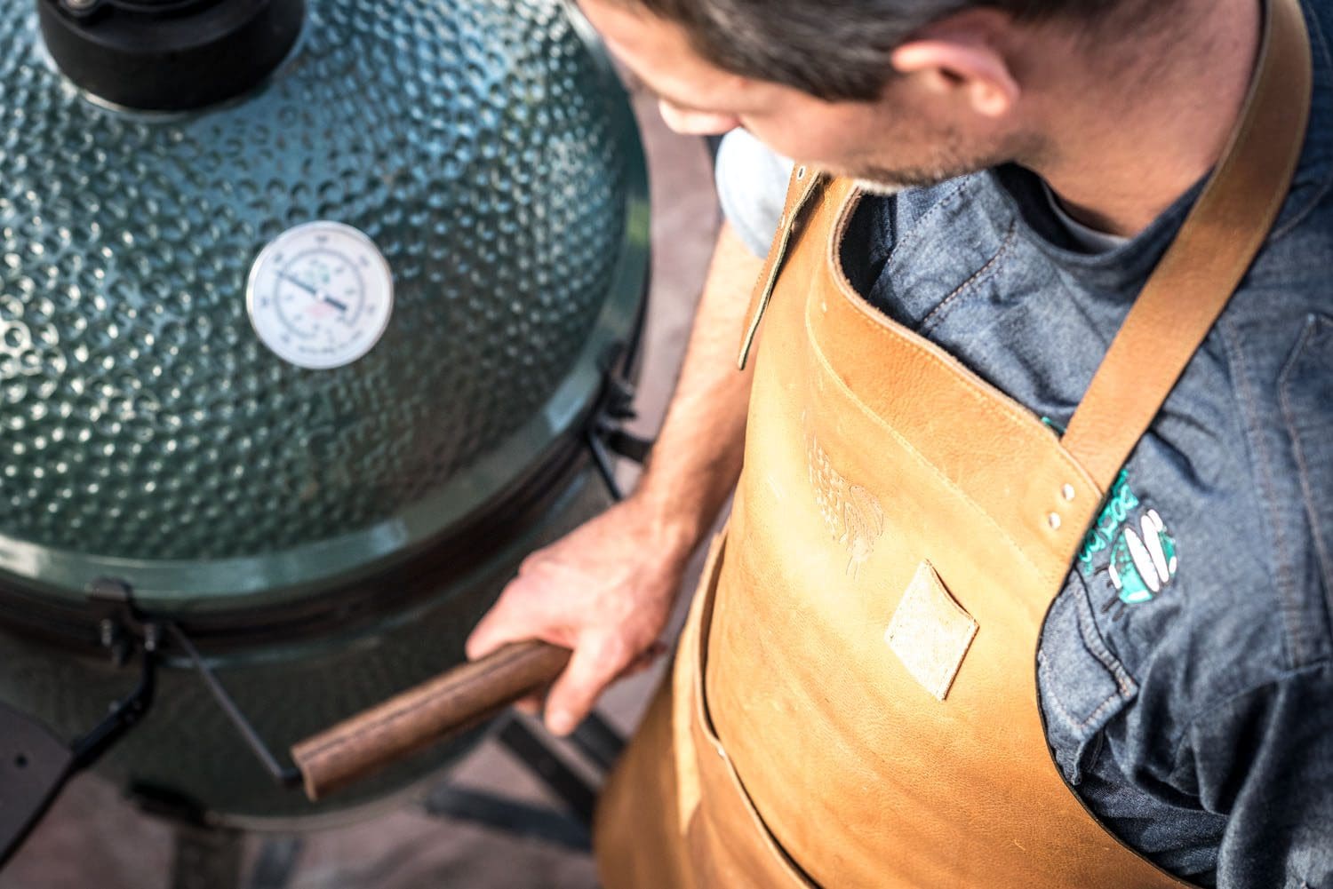 The Big Green Egg large ceramic smoker can bake bread, cook steaks, and more.