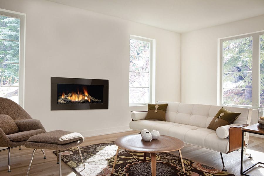 The Regency Horizon HZ40E Gas Fireplace with a black metal exterior in a living room with white furniture