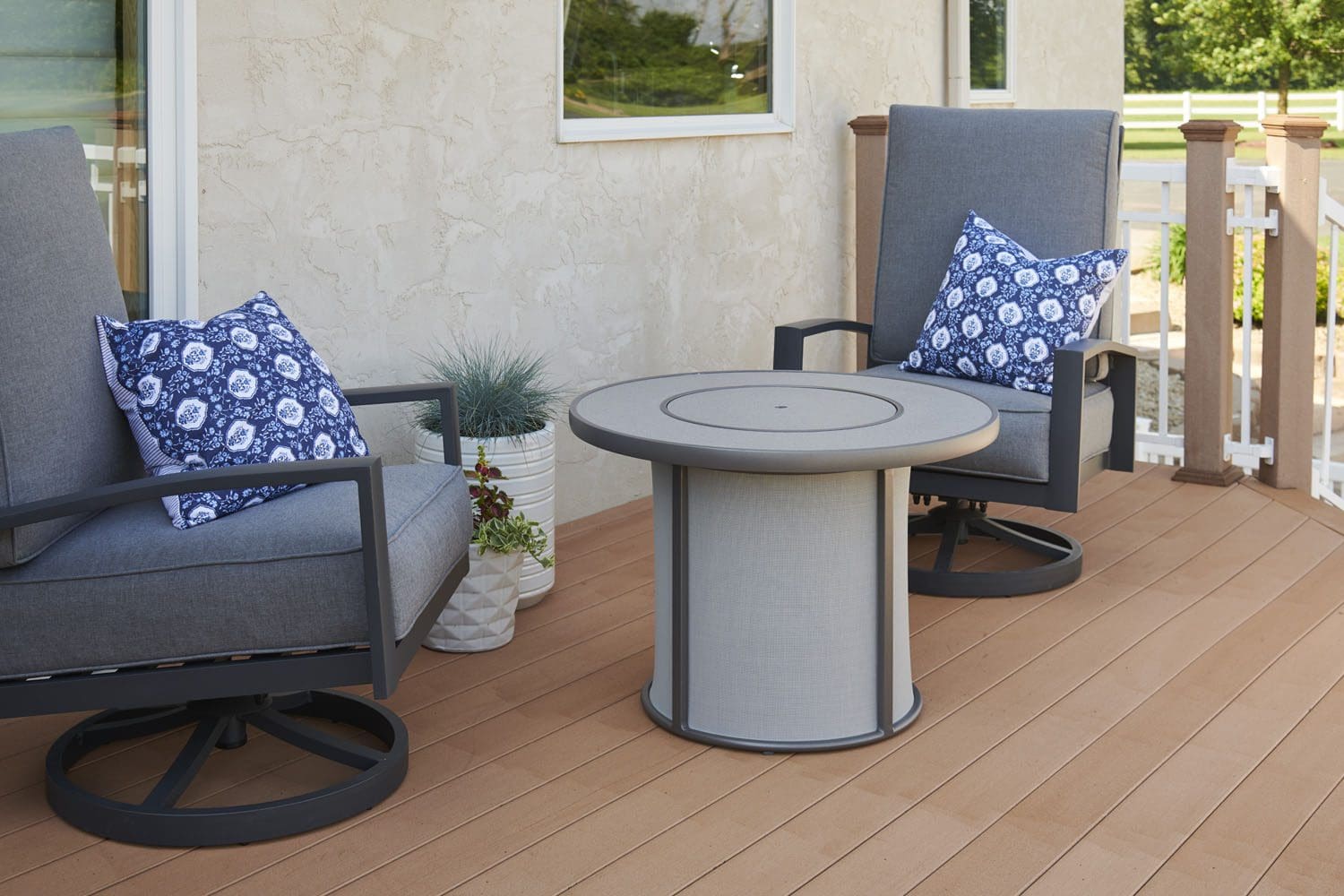 The outdoor greatroom stonefire fire pit table pictured with the grey cover