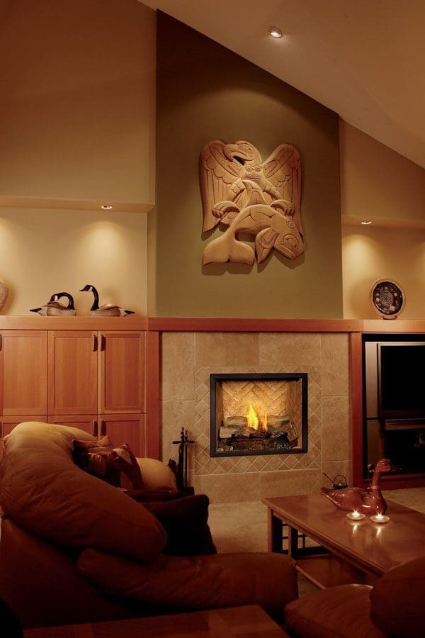 The Town & Country TC30 Gas Fireplace in tan stone in a living room