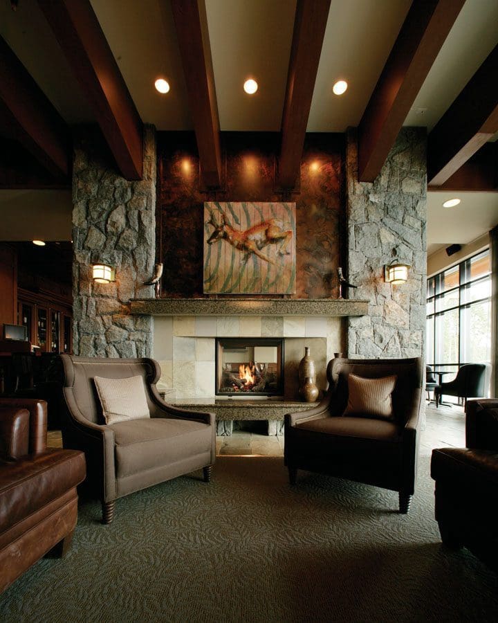 The Town & Country TC36 See Thru Gas Fireplace in a living room with brown furniture