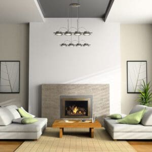 Picture of a GI 635 gas fireplace insert by Jotul with a bronze steel front and black outer surround