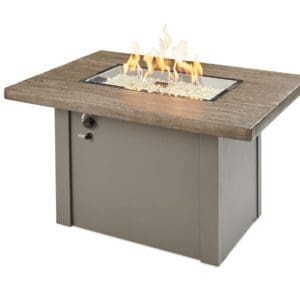 Perfect to sit around after a long day, the Outdoor Greatroom Havenwood Rectangular Gas Firepit will keep the space bright and comfortable.