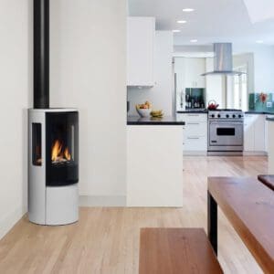 Corner installation of a Regency Contura freestanding contemporary gas stove in a white enamel finish.