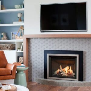 Picture of the Valor Legend G3.5 gas insert with layered brushed nickel front, black 3 sided surround, contemporary driftwood logset, matte black fluted interior panels
