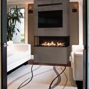 The Valor LX2 series gas fireplace offers an incredible view of the flame from multiple points throughout the room, with a three-sided glass viewing area.