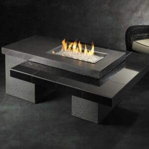 The Outdoor Greatroom Uptown gas fire pit table is a modern and elegant design combining granite and stucco in an artfully layered look.
