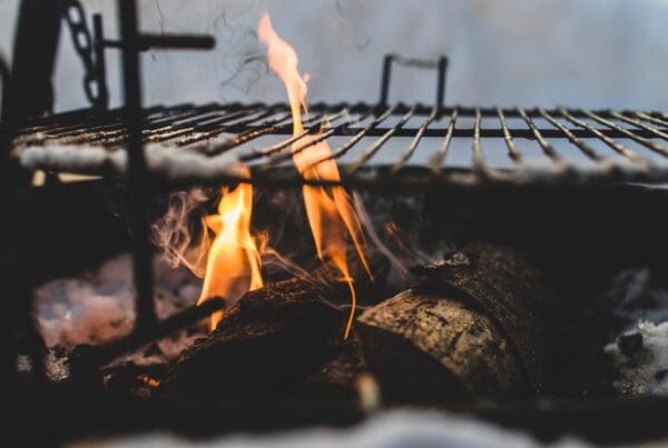 How do you decide between charcoal vs gas grills?