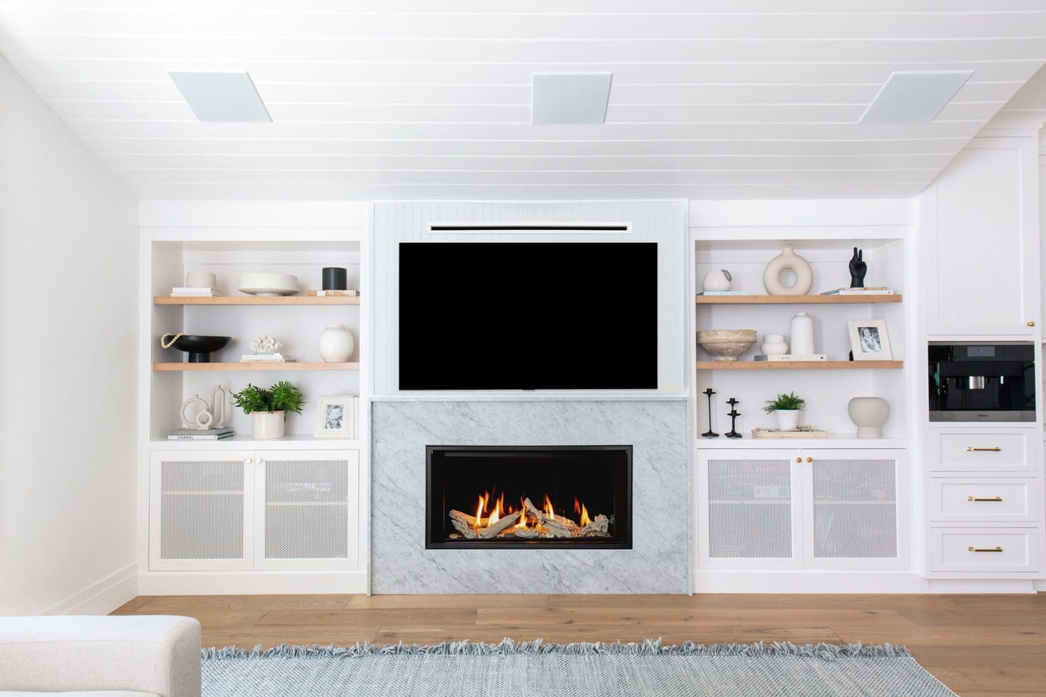 Valor LT1 Birch Fireplace with a TV mounted above it