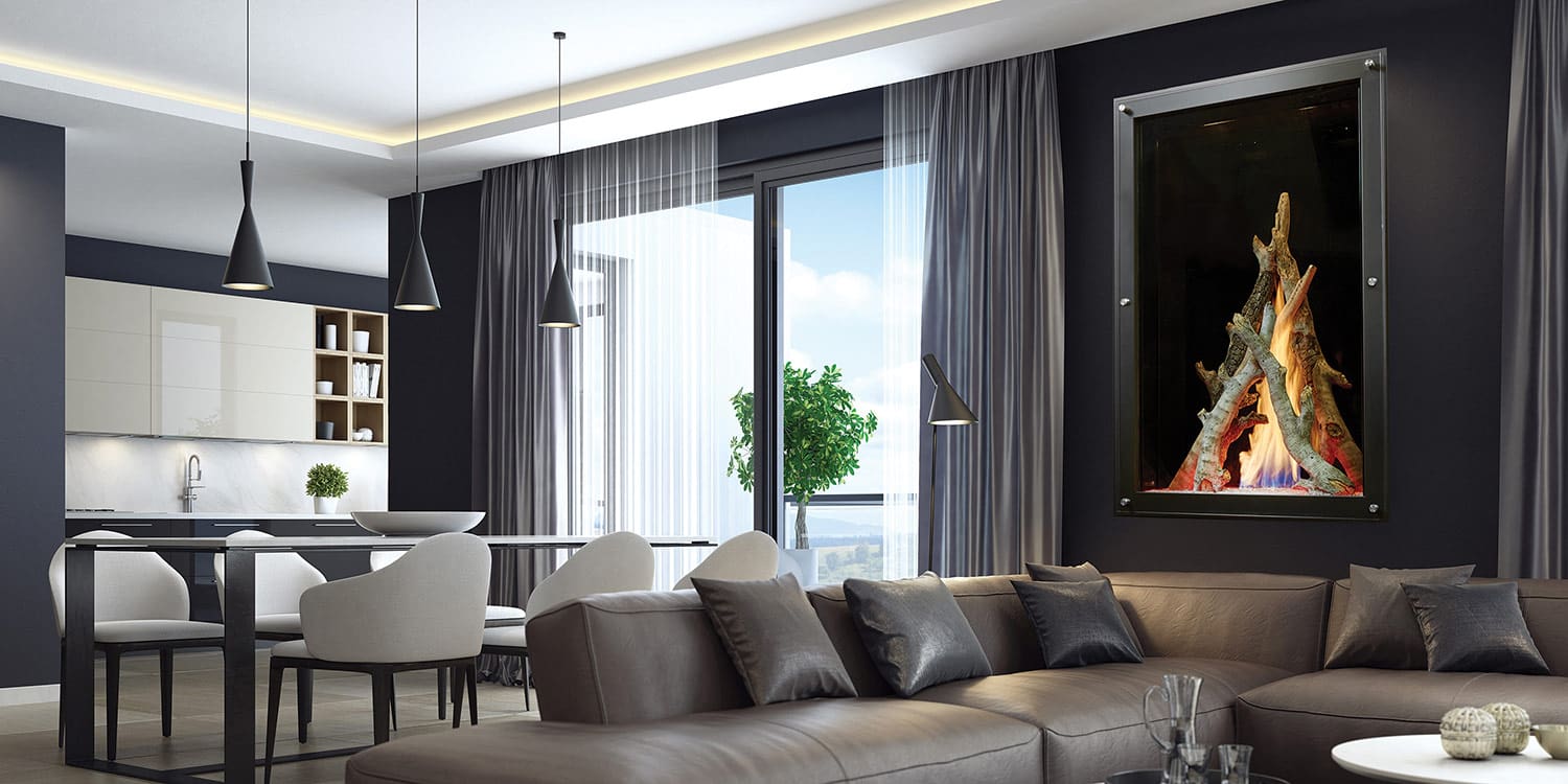 Modern open-plan living room and kitchen with gray furnishings, sectional sofa, dining table, pendant lights, large windows, and a sleek Maestro Collection™ By Davinci Custom Fireplaces single-sided linear gas fireplace mounted on the wall.